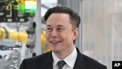 FILE - Tesla CEO Elon Musk attends the opening of the Tesla factory Berlin Brandenburg in Gruenheide, Germany, 3.22.2022. Twitter shareholders have filed a lawsuit accusing Musk of sought to drive down Twitter’s stock to negotiate a walkaway or a lower purchase price. 