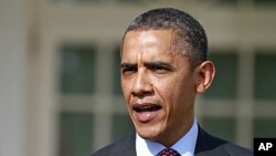 President Barack Obama answers a reporter's question about the death of Trayvon Martin, in the Rose Garden of the White House in Washington, March 23, 2012.