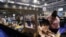 Election staff members count votes for the Scottish parliamentary election at a counting center in Glasgow, Scotland, May 8, 2021. 