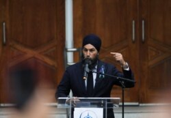 FILE - Canada's New Democratic Party leader Jagmeet Singh speaks at London Muslim Mosque in London, Ontario, Canada, June 8, 2021.