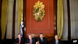 FILE - Brazil's Ambassador to Uruguay Paulo Estivallet, left, Paraguay's Foreign Affairs Minister Eladio Loizaga, second from left, Uruguay's Foreign Affairs Minister Rodolfo Nin, third from left, and Argentina's Vice-Foreign Affairs Minister Carlos Foradori give a press conference after a Mercosur meeting on the transition of the organization's presidency in Montevideo, Uruguay, July 11, 2016