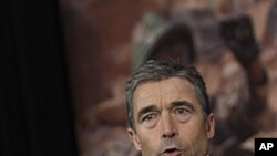 NATO Secretary-General Anders Fogh Rasmussen speaks during a media conference after a meeting of NATO defense ministers at NATO headquarters in Brussels on June 9, 2011.