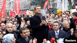 FILE - Turkey's main opposition Republican People's Party (CHP) mayoral candidate Mustafa Sarigul (C) speaks during a protest against Turkey's ruling AK Party and Prime Minister Tayyip Erdogan in Istanbul.