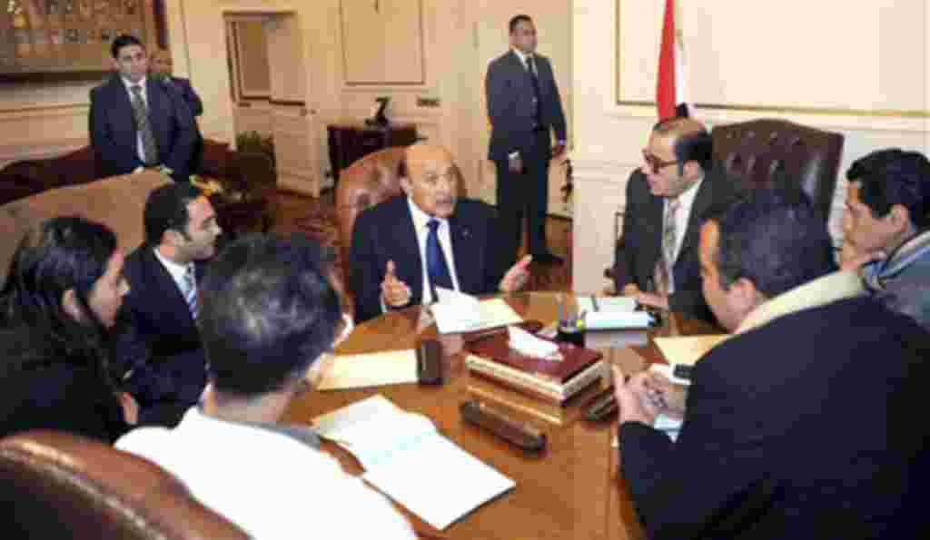Egyptian Vice President Omar Suleiman, center, meets with representatives of protesters in Cairo, February 6, 2011