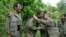 Kurdish fighters from the Kurdistan Workers Party (PKK) congratulate each other after arriving in the Heror area, northeast of Dahuk, 260 miles (430 kilometers) northwest of Baghdad,  May 14, 2013. 