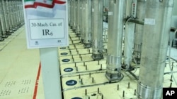 FILE - This photo released on Nov. 5, 2019, by the Atomic Energy Organization of Iran shows centrifuge machines in the Natanz uranium enrichment facility in central Iran.