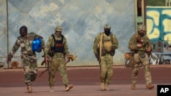 This undated photograph provided by the French military shows three Russian mercenaries in northern Mali. (French Army via AP, File)