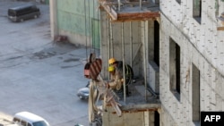 FILE- North Korean workers at a construction site in the capital Ulaanbaatar on October 6, 2017. 