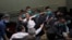 Pan-democratic legislator Lam Cheuk-ting is taken away by security during a Legislative Council's House Committee meeting in Hong Kong, May 18, 2020.