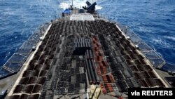 Thousands of illicit weapons are shown aboard the guided-missile cruiser USS Monterey. They were seized from a stateless dhow in international waters of the North Arabian Sea in this picture taken May 8, 2021, and released by the U.S.Navy, May 9, 2021.