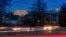 A car moves along U.S. Highway 50 early in the morning, March 30, 2018, across the Potomac River from Washington in Arlingotn, Virginia. The Trump administration is expected to announce that it will roll back automobile gas mileage and pollution standards that were approved during the Obama administration.