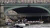 The royal barge Gloriana carries the Olympic flame along the river Thames, on the final day of the Torch Relay, London, July 27, 2012. 