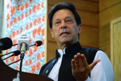 FILE - Pakistan's Prime Minister Imran Khan addresses the legislative assembly in Muzaffarabad, the capital of Pakistan-controlled Kashmir, Aug. 5, 2020.