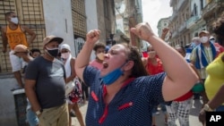 A woman shouts pro-government slogans as anti-government protesters march in Havana, Cuba, July 11, 2021.