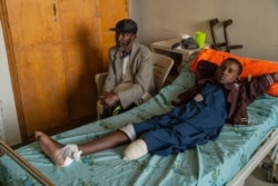 Michaele Kahsay, 16, who was injured by artillery fire and lost the lower part of his left leg, is pictured in Mekelle, Ethiopia, June 4, 2021. His brother was also injured and he did not survive. (Yan Boechat/VOA)