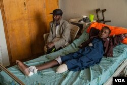 Michaele Kahsay, 16, who was injured by artillery fire and lost the lower part of his left leg, is pictured in Mekelle, Ethiopia, June 4, 2021. His brother was also injured and he did not survive. (Yan Boechat/VOA)