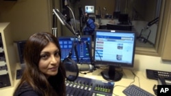 Radio Farda producer Sara Valinejad sits in the studio, Oct. 11, 2006, in Springfield, Virginia.