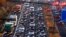 Cars and trucks queue on the highway A5 in Frankfurt, Germany, Nov. 6, 2017. Some in the EU propose cutting emissions of carbon dioxide from cars by 30 percent by 2030 but others say the plan is too ambitious to be economically sustainable.