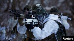 South Korean and U.S. Marines participate in a winter military drill in Pyeongchang, South Korea, Jan. 24, 2017. 