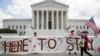 DACA recipients and their supporters celebrate outside the Supreme Court in Washington, June 18, 2020.