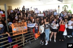 BTS fans wait outside the red carpet before the start of the Billboard Music Awards at the MGM Grand Garden Arena on Sunday, May 20, 2018, in Las Vegas. (Photo by Jordan Strauss/Invision/AP)