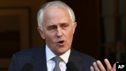 FILE - Australia Prime Minister Malcolm Turnbull announces his new cabinet during a press conference at Parliament House in Canberra, Australia, Sept. 20, 2015. 