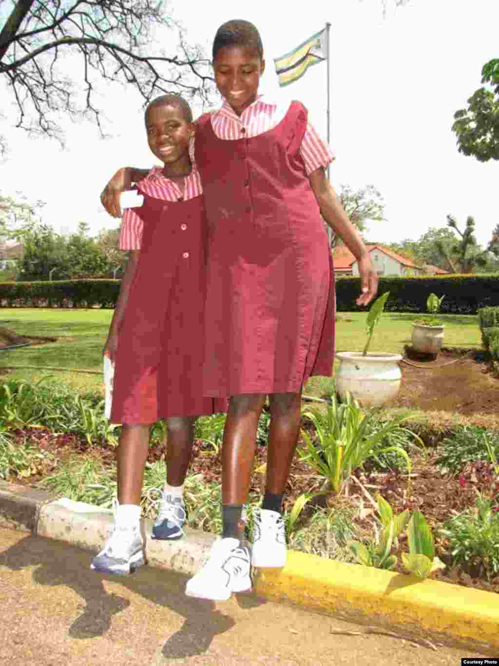 Girls at a Zimbabwean school wearing new shoes shipped from USA. (Photo: Noah Manyika)