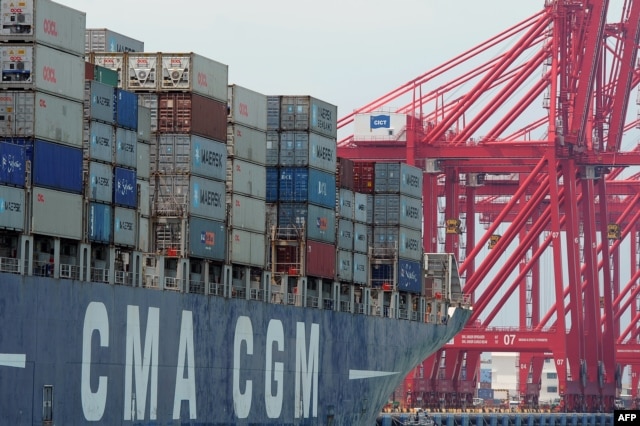 FILE - A ship loaded with containers ready for departure is seen berthed at the Chinese-majority owned Colombo International Container Terminal (CICT) in Colombo on March 30, 2016.