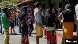 People queue at a polling station during Paraguay's general elections, in Mariano Roque Alonso, Paraguay April 30, 2023.