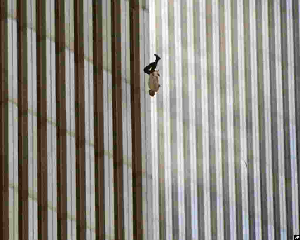 A person falls from the north tower of New York's World Trade Center Tuesday Sept. 11, 2001after terrorists crashed two hijacked airliners into the World Trade Center and brought down the twin 110-story towers. (AP Photo/Richard Drew)