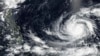 Esta imagen satelital del martes 23 de mayo de 2023 publicada por la NASA muestra el tifón Mawar, una poderosa tormenta que podría causar el mayor impacto en dos décadas en el territorio estadounidense en el Pacífico, acercándose a Guam. (NASA vía AP)