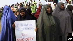 Muslim women attend a rally at Gani Fawehinmi freedom square on the fifth day of a protest against a fuel subsidies removal, in Lagos January 13, 2012.