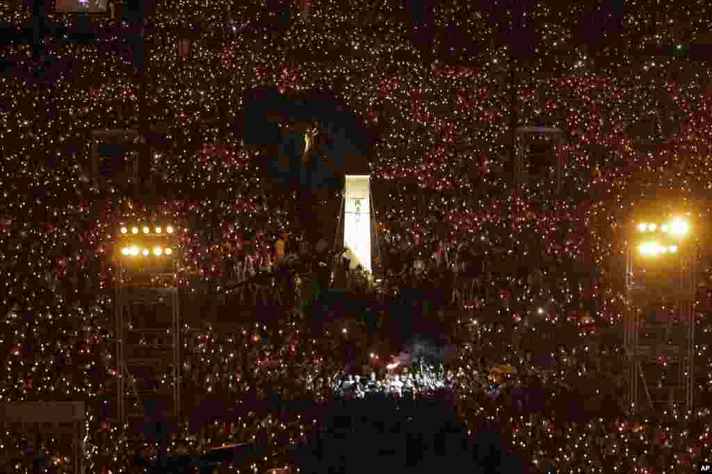 Thousands of people attend a gathering at Victoria Park in Hong Kong for victims of the Chinese government&#39;s military attack thirty years ago on protesters in Beijing&#39;s Tiananmen Square.