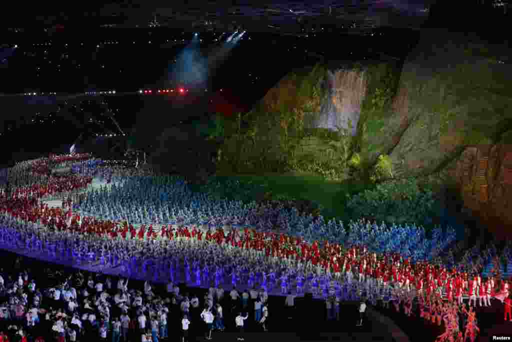 Athletes march during the opening ceremony of the 18th Asian Games at Gelora Bung Karno Stadium in Jakarta, Indonesia, Aug. 18, 2018.