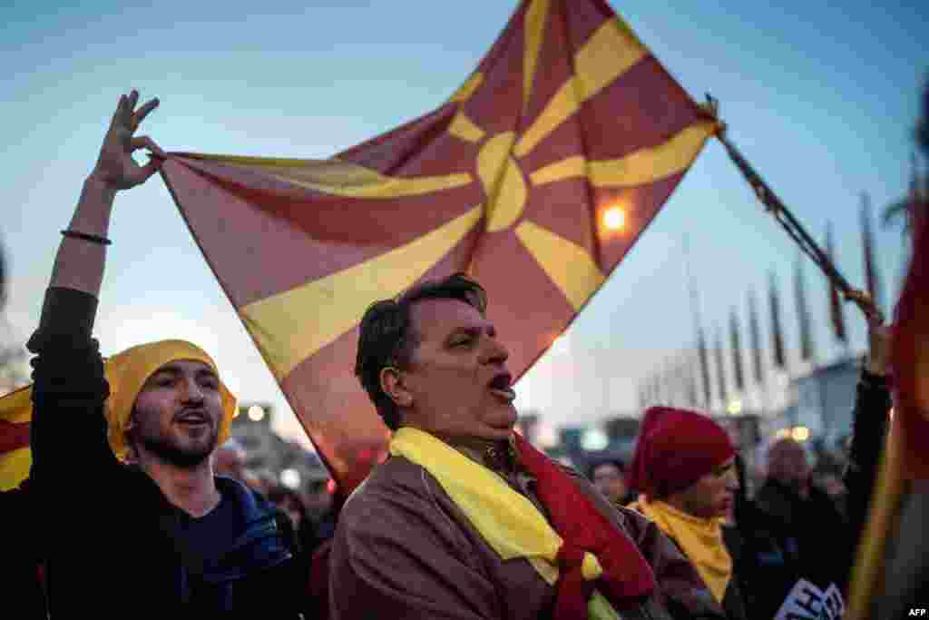 People protest in Skopje against a deal between the Social democrats and the Albanian Democratic Union for Integration for a law which would make Albanian the second official language, as part of new government talks.