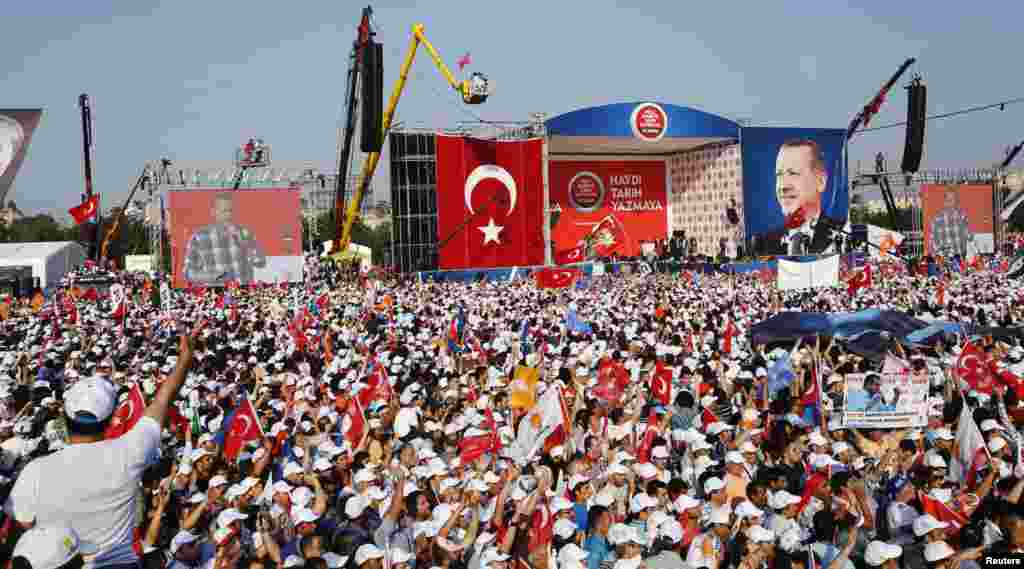 Turkish Prime Minister Tayyip Erdogan addresses his supporters during a rally by his ruling AK Party in Istanbul June 16, 2013. Erdogan rallied hundreds of thousands of supporters at an Istanbul parade ground on Sunday as riot police fired teargas several