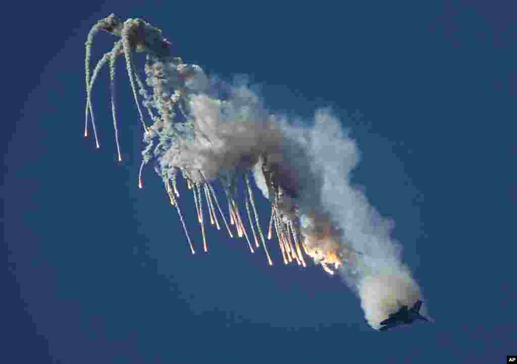 A Su-27 jet of aerobatics team Russkiye Vityasy, or Russian Knights, performs during the International Maritime Defense show in St. Petersburg, Russia. &nbsp;