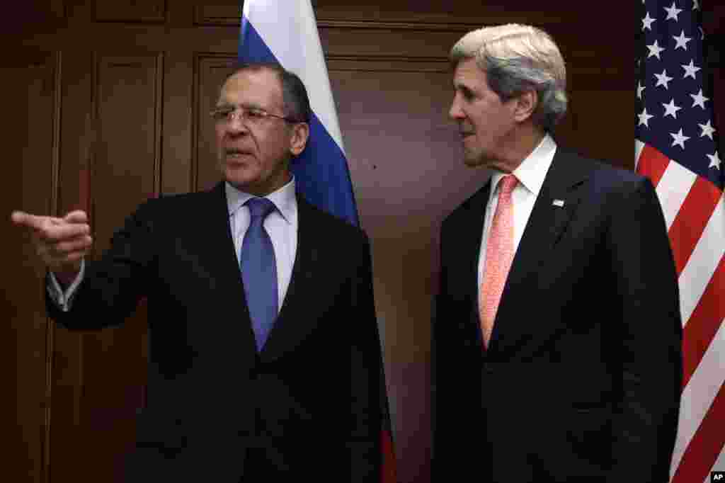 Russian Foreign Minister Sergei Lavrov gestures while standing with U.S. Secretary of State John Kerry in Berlin, Germany, Feb. 26, 2013. 