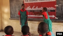 Schoolgirls practice how to protect themselves from assault at one of the classes Ujamaa Pamodzi Africa offers in Malawi