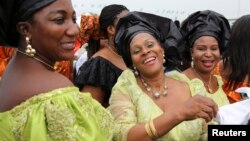 FILE - Delegates from Delta state take part in a parade during the "peace rally" organized by the National Council for Women's Societies (NCWS) in Abuja, Nigeria, Aug. 15, 2013.