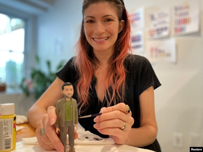 Alyssa Zeller Feinberg, FCTRY chief design officer, with a prototype of the Zelenskiy action figure in Brooklyn, NY, August 9, 2022. (REUTERS/Roselle Chen)