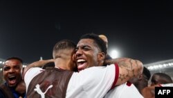 Cape Verde's defender Logan Costa celebrates victory with his teammates after defeating Mauritania 1-0 in the round of 16 at the 2023 Africa Cup of Nations, the Felix Houphouet-Boigny Stadium in Abidjan, Jan. 29, 2024.