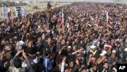 Protesters chant slogans against Iraq's Shiite-led government during a demonstration in Fallujah, Jan. 4, 2013.