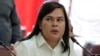 FILE -Philippine Vice President Sara Duterte gestures as she attends a hearing at the House of Representatives in Quezon City, Philippines, Nov. 25, 2024.