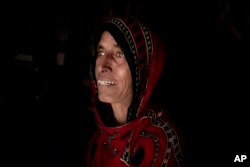 Hagar Yahia, a Yemeni mother of eight, cries in her hut in Abyan, Feb. 9, 2018.