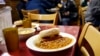 FILE - A lunch is served in a New York City soup kitchen.