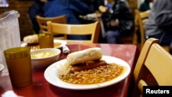 FILE - A lunch is served in a New York City soup kitchen.