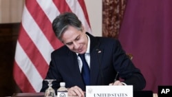 Secretary of State Antony Blinken and Qatar's Foreign Minister Sheikh Mohammed bin Abdulrahman Al Thani, not pictured, participate in a signing ceremony at the State Department in Washington, Nov. 12, 2021.