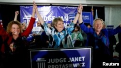 Wisconsin Supreme Court candidate Janet Protasiewicz celebrates alongside Wisconsin Supreme Court Judges Rebecca Dallet and Ann Walsh Bradley, after the race was called for her during her election night watch party in Milwaukee, Wisconsin, April 4, 2023. 