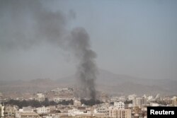 FILE - Smoke rises after an airstrike in Sanaa, Yemen, Dec. 15, 2017.
